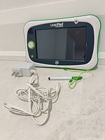 Front view of LeapPad Ultimate tablet with stylus and charger