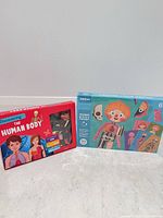 Both boxed anatomy magnetic puzzle sets front view