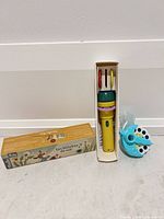 Entire lot showing Moulin Roty projector in tray with discs, outer box, and separate Moonlite projector