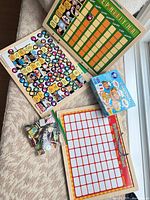 Overview of both responsibility charts, Crazy Chefs game box, bag of magnets