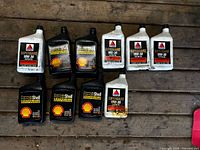 Ten bottles of motor oil: five white CITGO Supergard, five black FormulaShell