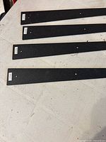 Close view of four strap handles