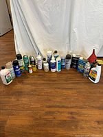 All containers arranged in semicircle on floor