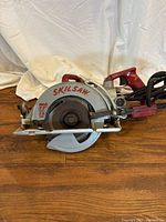 Full view of Skilsaw Model 77 circular saw, blade side
