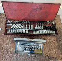 open red toolbox showing rows of sockets and extensions