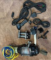 Overview of winch with accessories including wiring, remote, relay and fairlead