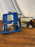 Both tire repair kits open showing contents