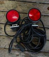 front view showing two red round magnetic trailer lights with wiring