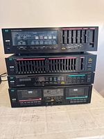 Front view of four stacked MCS components showing model labels and controls