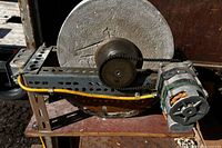Overall view of sharpening wheel, motor, belt drive and frame