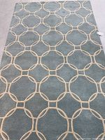 full view of the rug laid flat showing complete pattern