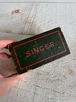 Top view of green Singer box showing logo and border