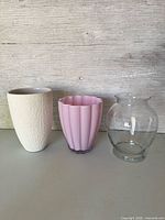 front view of three vases side by side