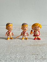 Front view of all three Hygrade figurines standing side by side