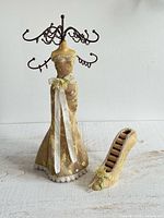 Full view of fabric mannequin jewelry stand and shoe ring holder