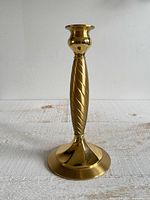 Full front view of brass Partylite candle holder