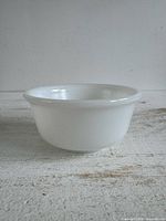 Side view of white milk glass mixing bowl