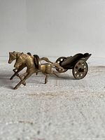 Left side view showing horses, carriage bowl and wheel details