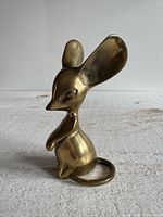 Front view of brass mouse figurine with large ears