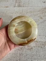 Top view showing round carved onyx ashtray and coloration
