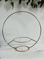 Full view showing circular frame and two internal pot rings