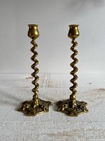 pair of brass candlesticks front view