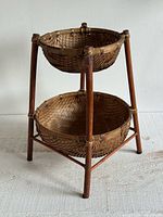 Full view of two-tier basket stand showing structure and proportions