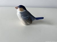 side view of porcelain bird figurine