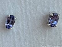 Front view showing tanzanite stones and prong settings