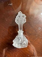 Full view of perfume bottle assembled with stopper inserted