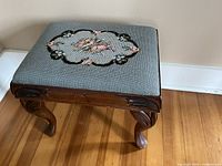Top view showing needlepoint floral seat and wood frame