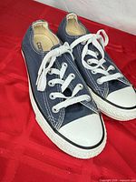 Top view of both sneakers showing laces, toe caps, and canvas uppers