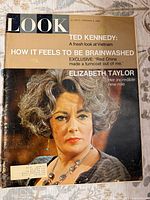 Front cover showing Elizabeth Taylor portrait, magazine title, date and headlines