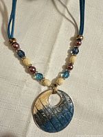 Front view of necklace showing pendant and bead arrangement