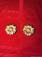 Front view of both gold-tone floral clip-on earrings