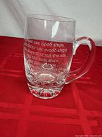 Front view of clear crystal beer stein showing etched Irish toast and handle