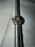 Front view of silver-tone stretch ring on mandrel