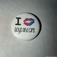 Front view of round pin showing design