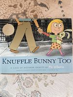 Front cover showing title, author Mo Willems, illustration of girl holding bunny