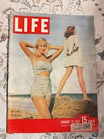 Front cover showing resort fashion model, Life masthead, date and price visible