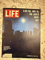 Front cover showing skyline blackout image, headline, date, price