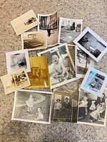 All 14 photographs spread out to show variety and condition