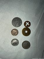 all six assorted coins laid out showing obverse designs