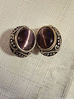 front view of both earrings showing purple stones and filigree
