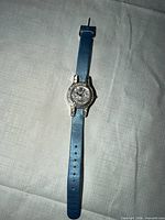 Front view of Victoria Wieck watch with blue strap showing crystal bezel and dial