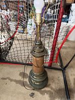 Full view of lamp including base, column, neck, harp and bulb