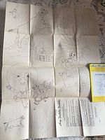 Full unfolded transfer sheet showing multiple nursery rhyme designs and envelope