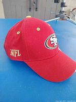 Side view showing 49ers front logo and NFL side script