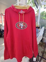 Front view showing 49ers logo, pocket, drawstrings