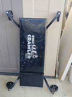 Front view of TraXion King Crawler creeper standing upright